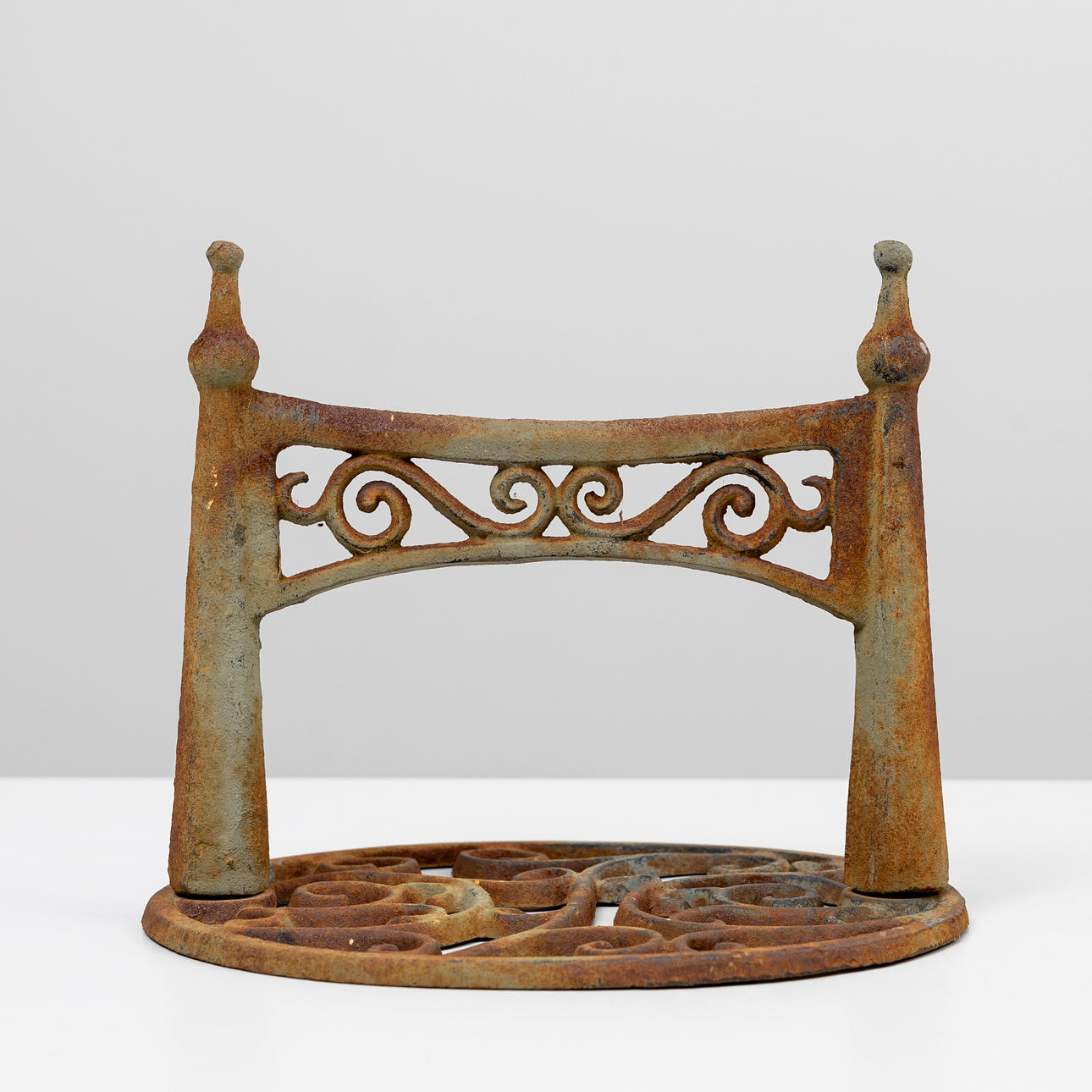 A cast iron foot scraper, 20th century.