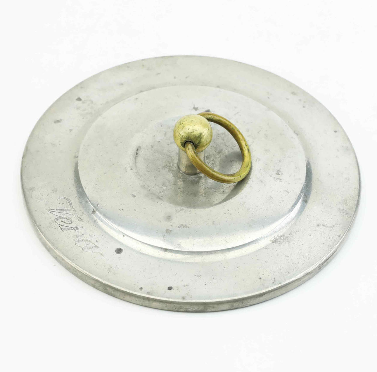 A 1940s brass pewter mirror.