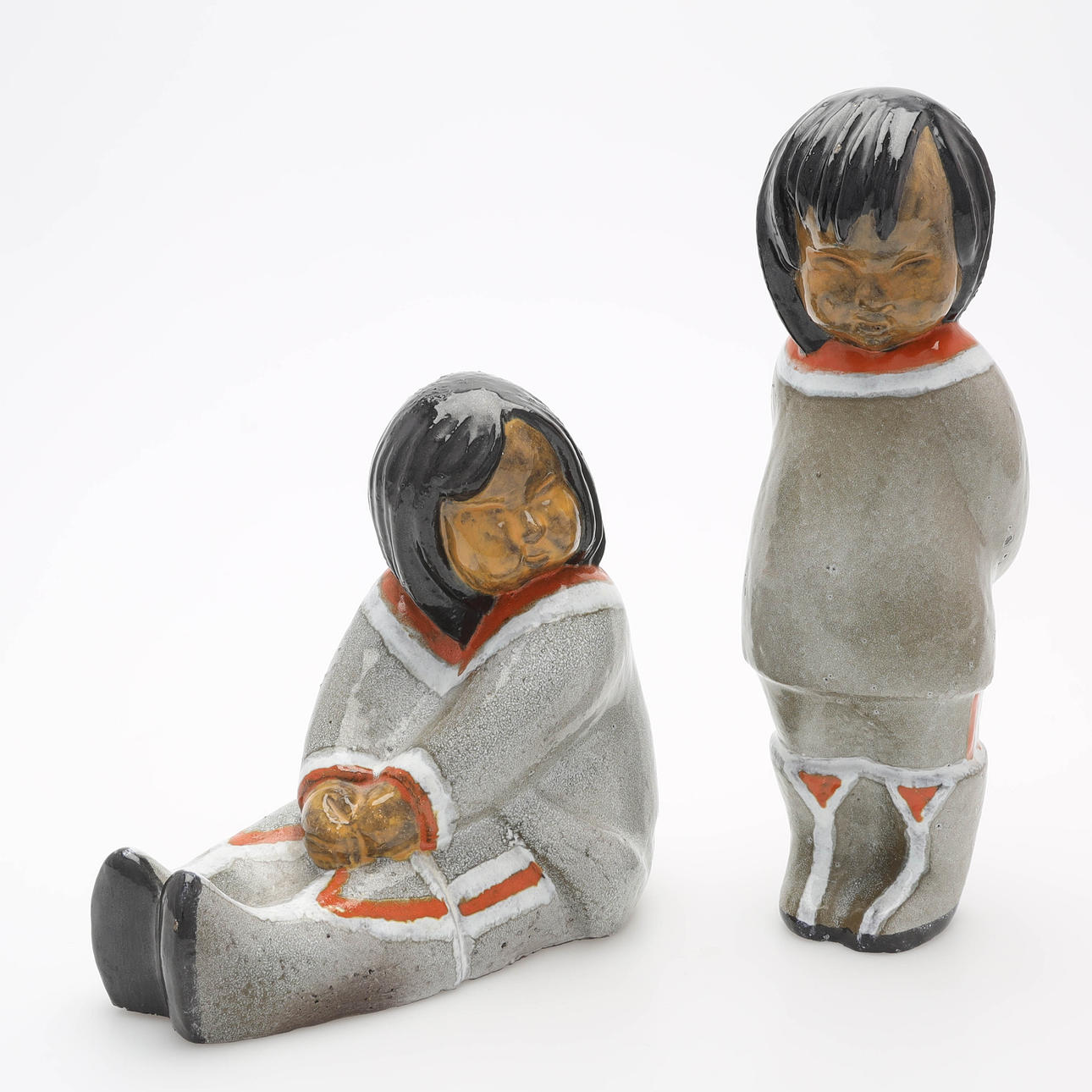 VICKE LINDSTRAND. Two glazed ceramic figurines, “Eskimo”, Upsala-Ekeby.
