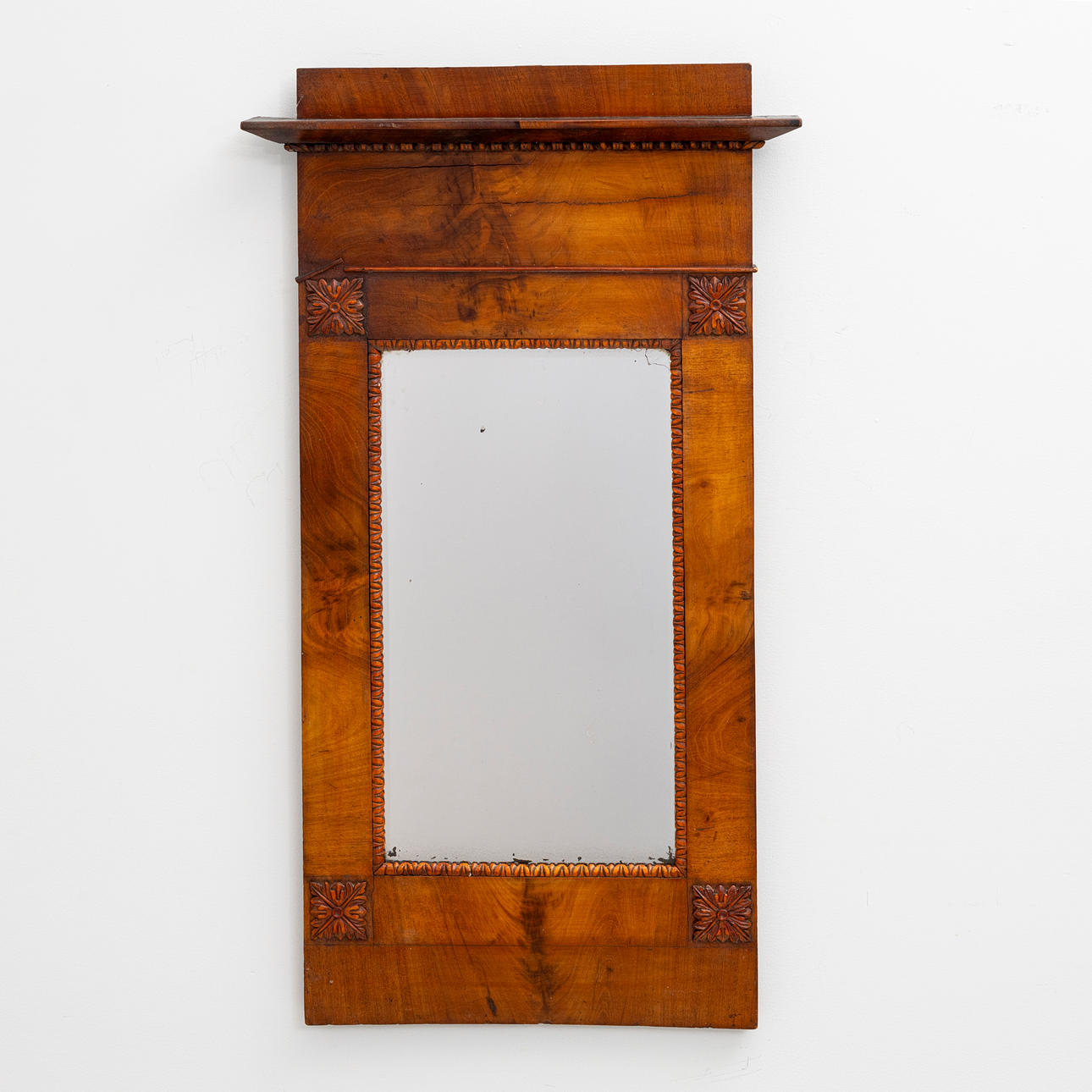 A 19th century veneered frame mirror.