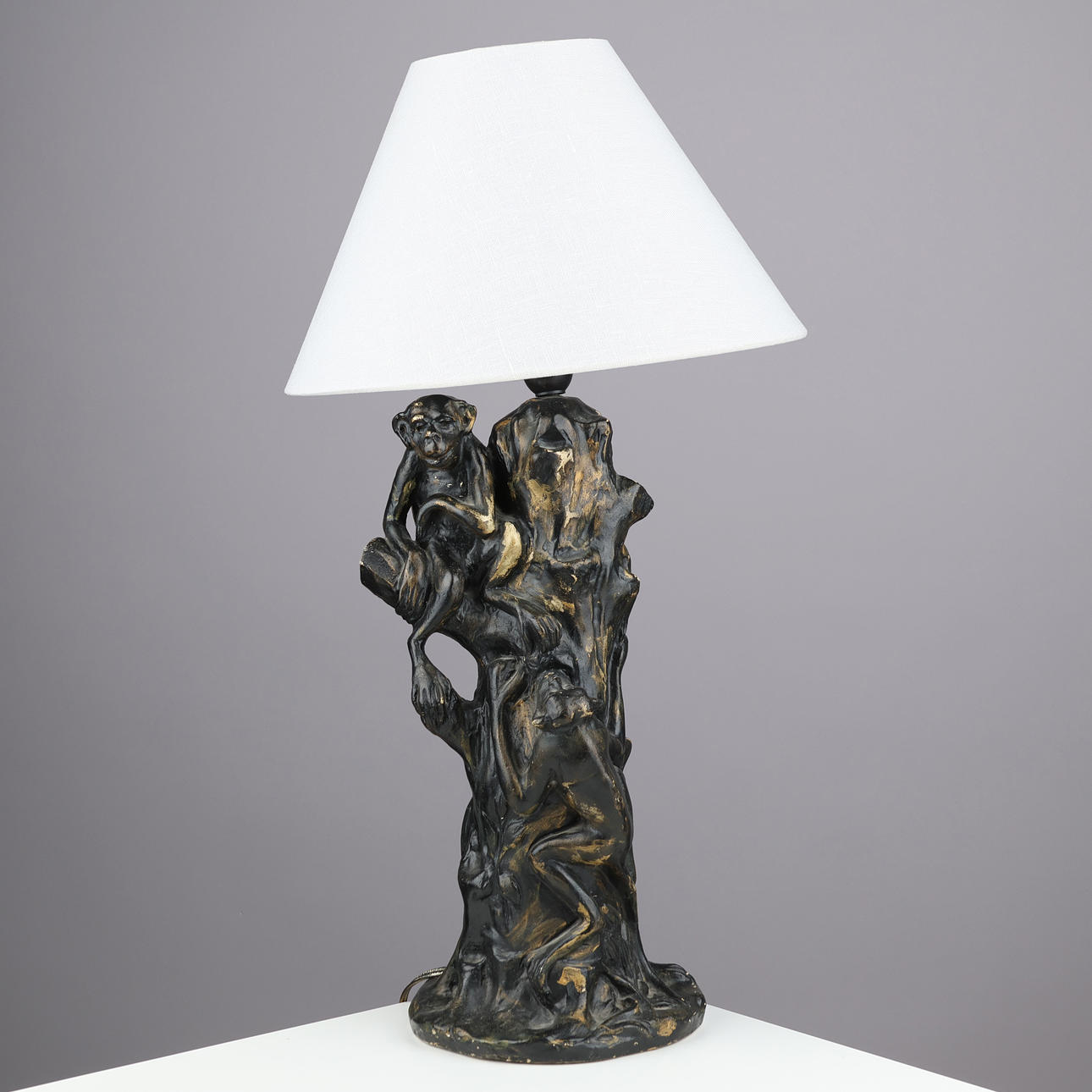 SIGNED ceramic table lamp designed as a tree trunk with climbing monkeys, unknown designer, 20th century.