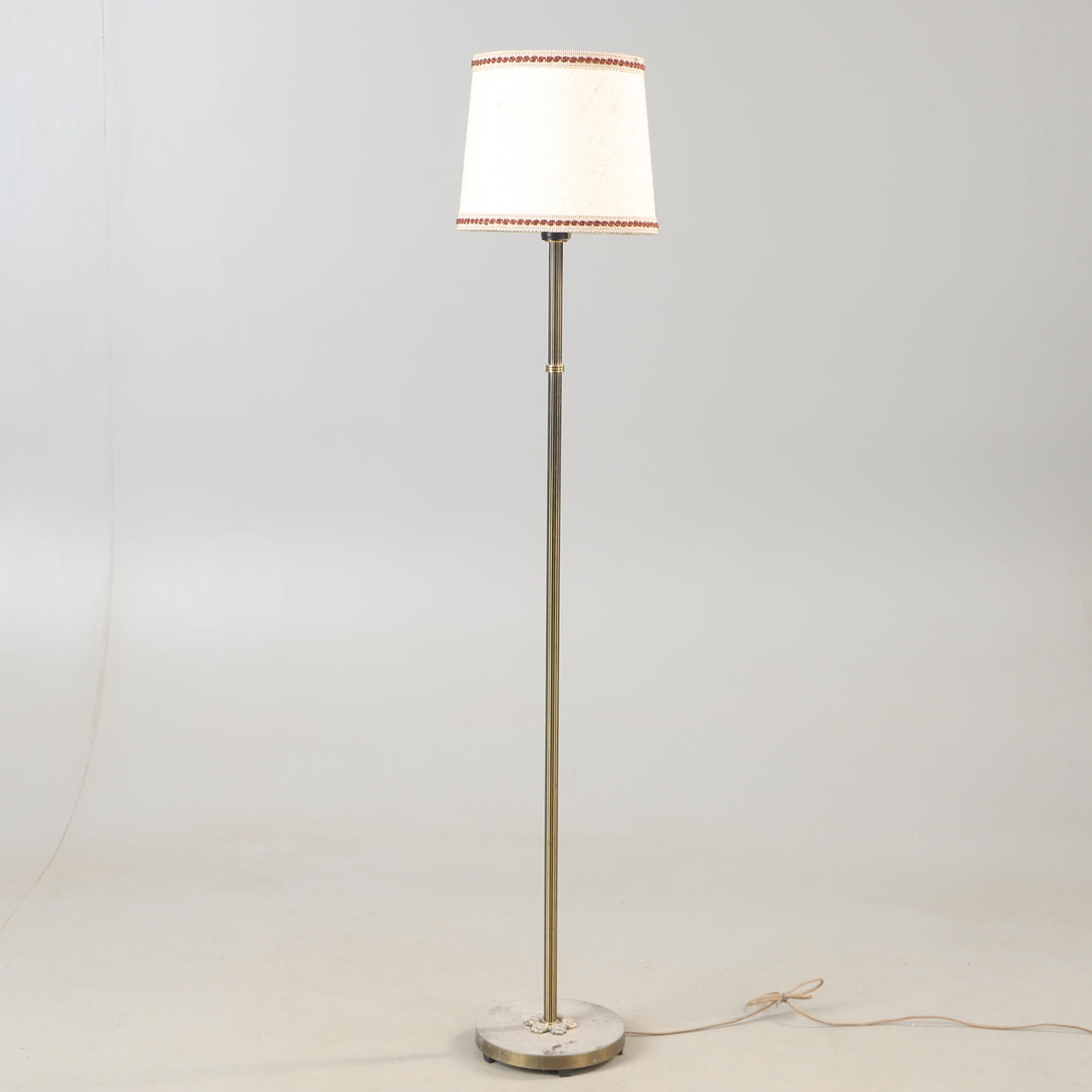 A brass floor lamp, mid 20th century.
