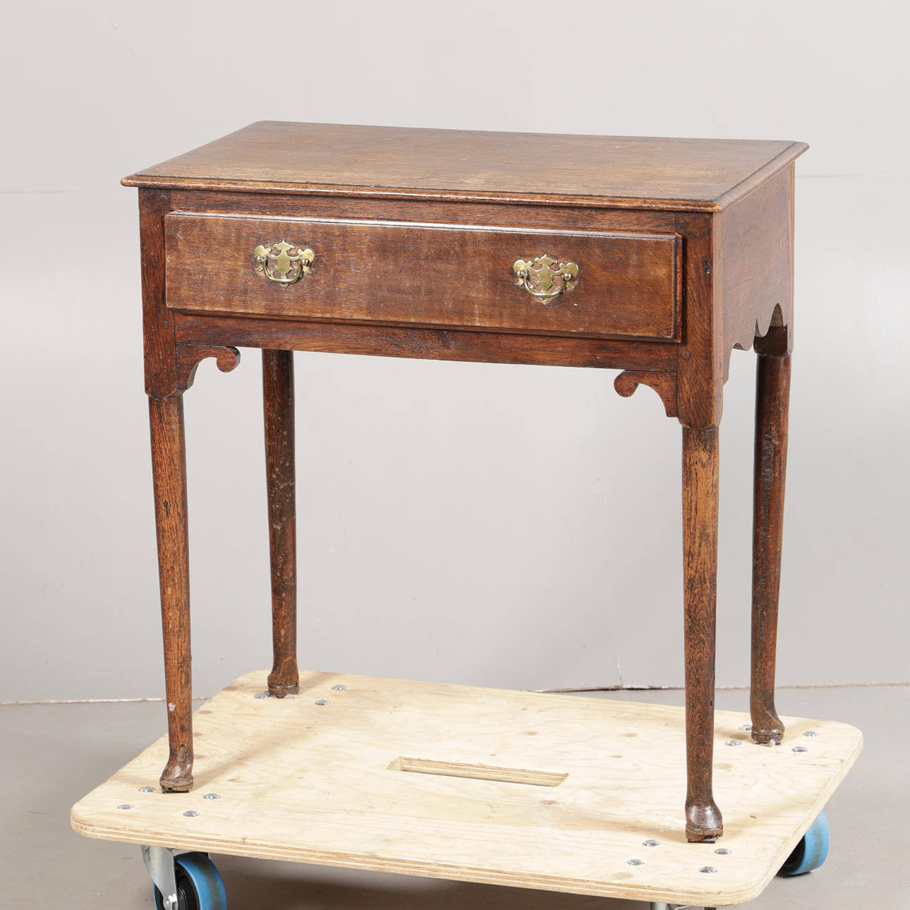 A GEORGE III OAK LOW BOY.