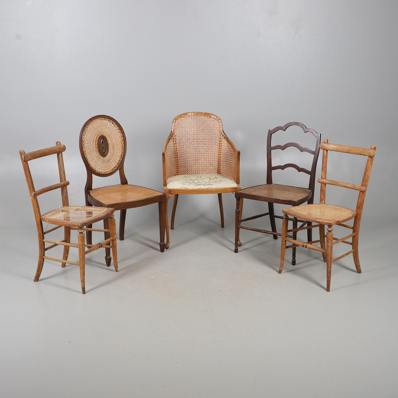 FIVE ASSORTED CANE SEAT CHAIRS.