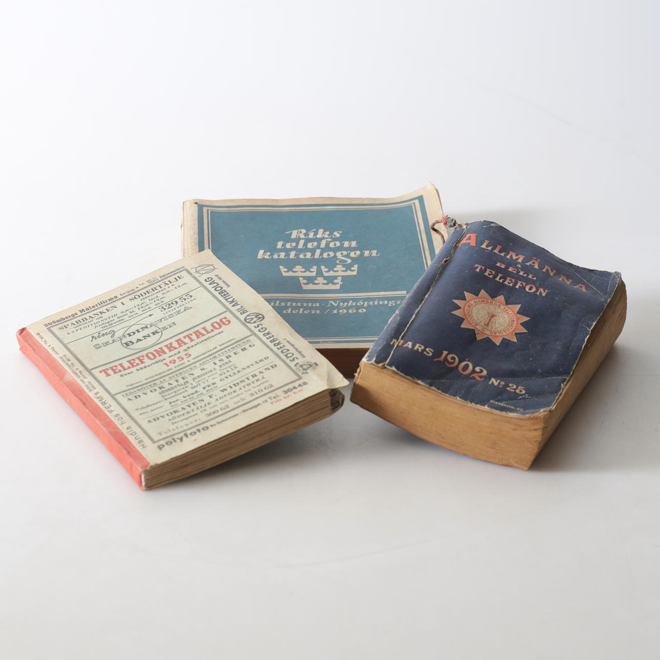 Three 20th century telephone directories.