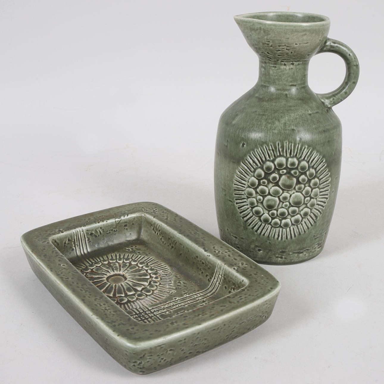 GUNNAR NYLUND. A glazed ceramic jug & saucer, “Zenit”, Rörstrands.