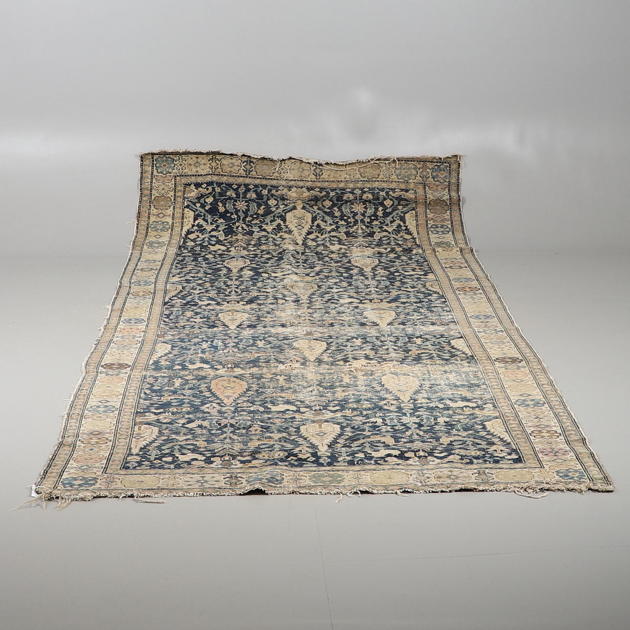 A MALAYIR RUG.
