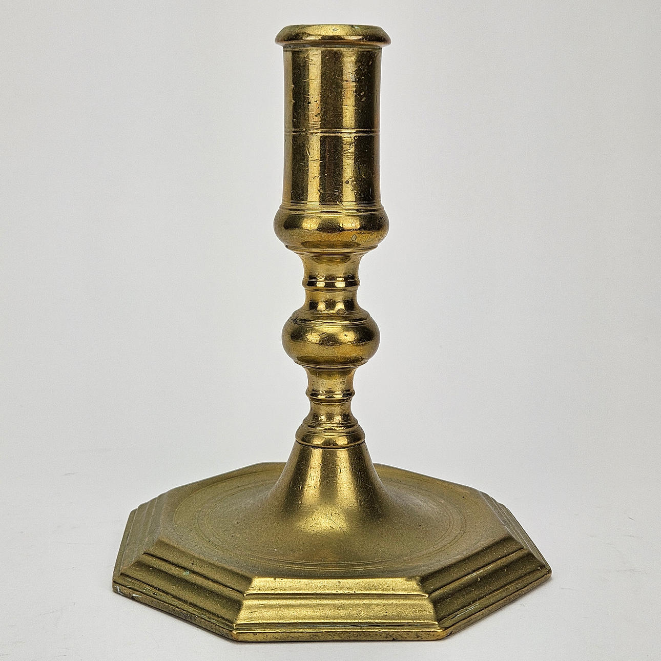 A brass candlestick, late baroque, 18th century.