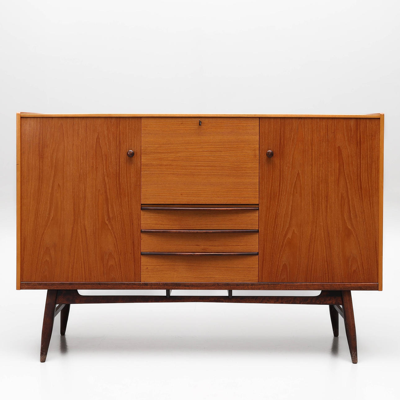 A 1950s/60s teak veneer sideboard.