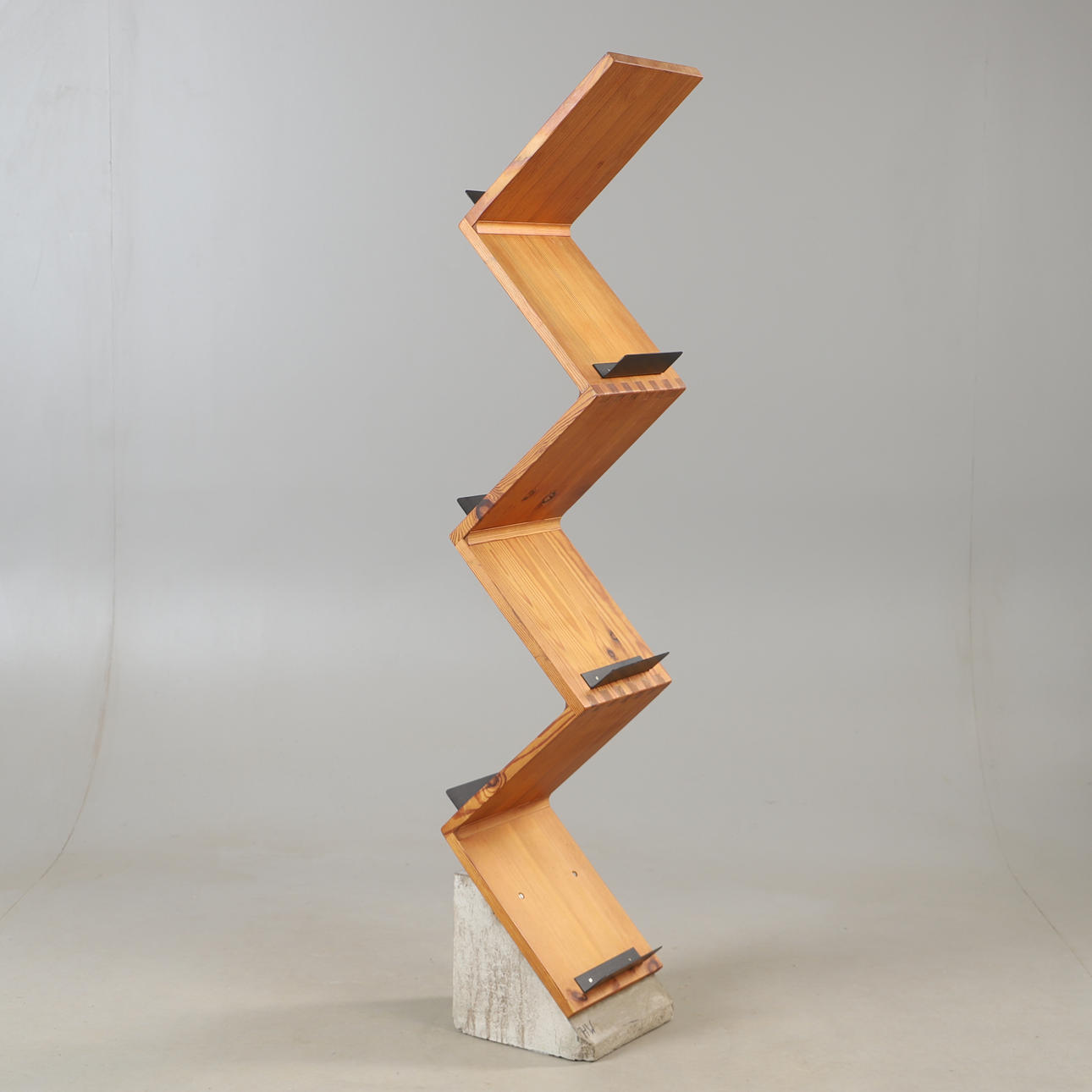 A 21st-century pine and concrete bookcase.