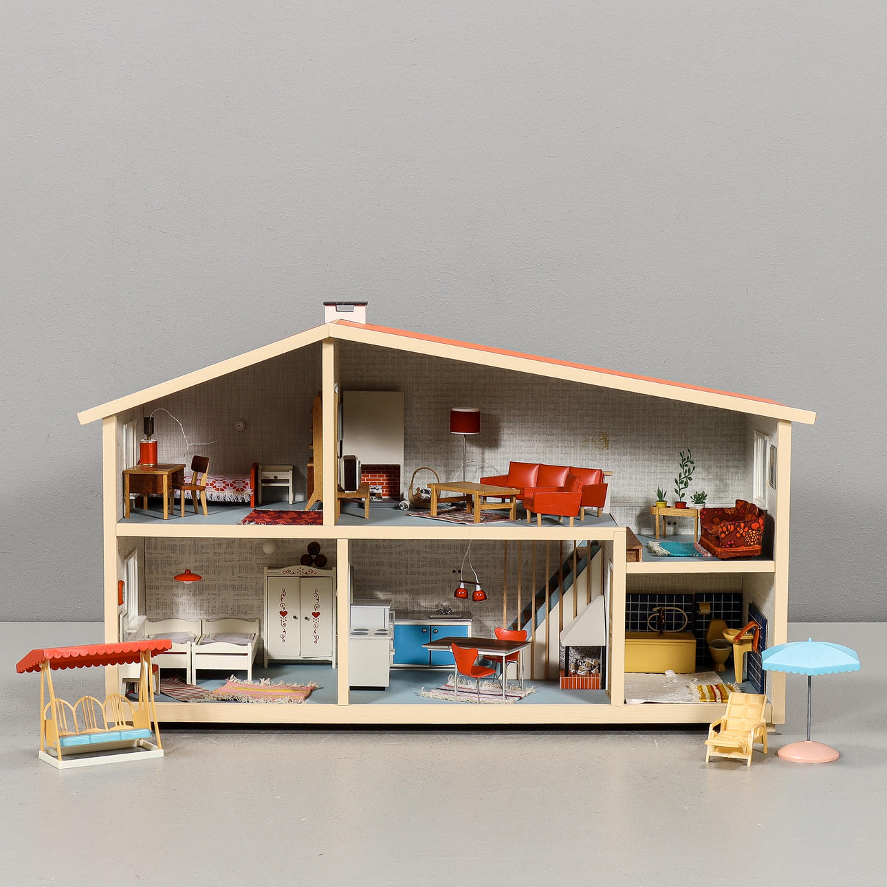 A Lundby doll cabinet, with various decor.