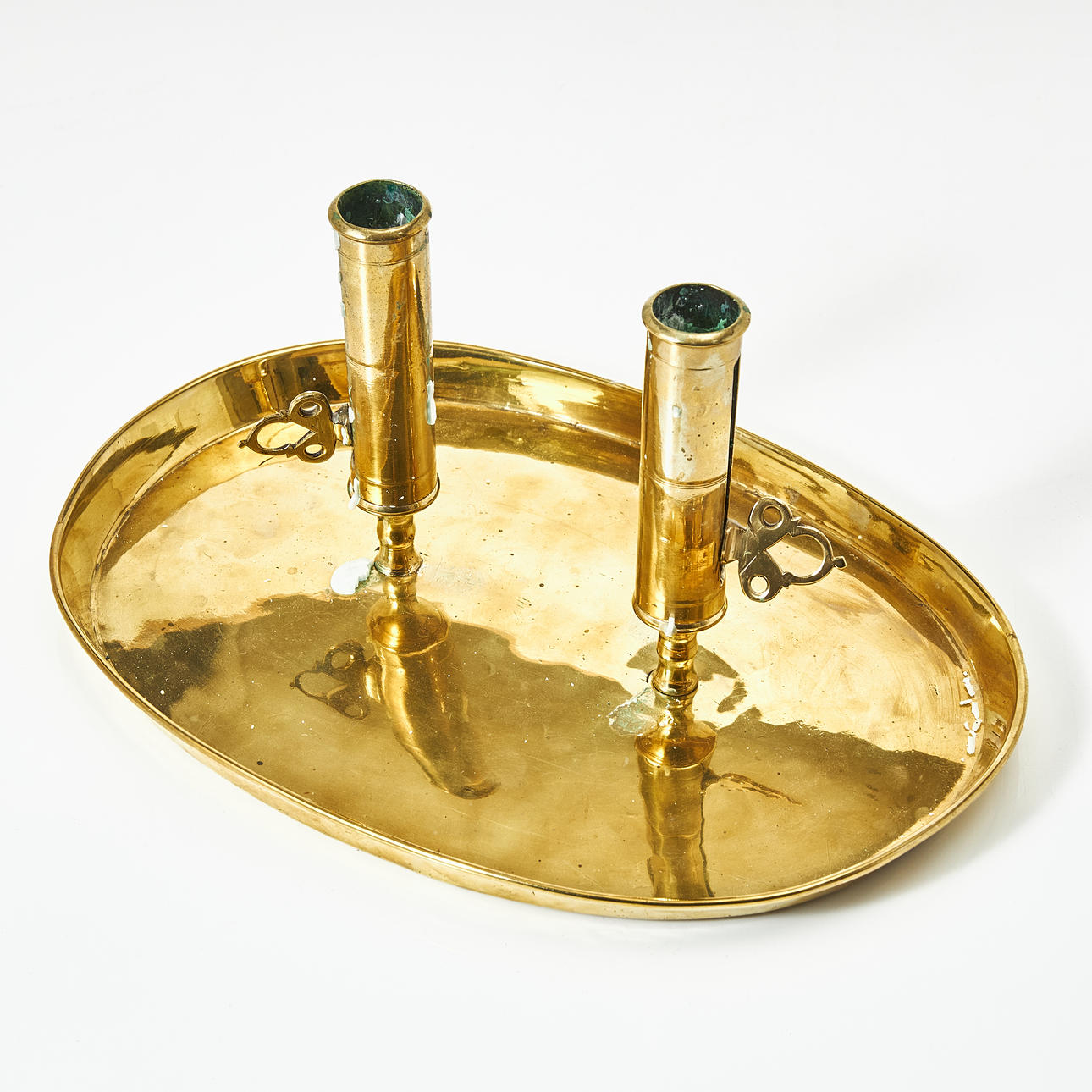 A double candlestick for two candles, brass, mid 19th century.