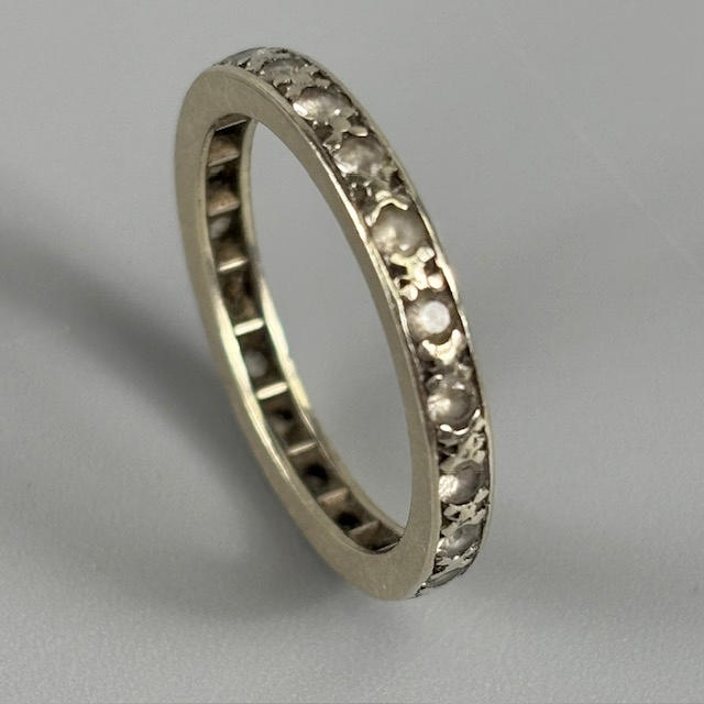 STONE SET FULL ETERNITY RING.