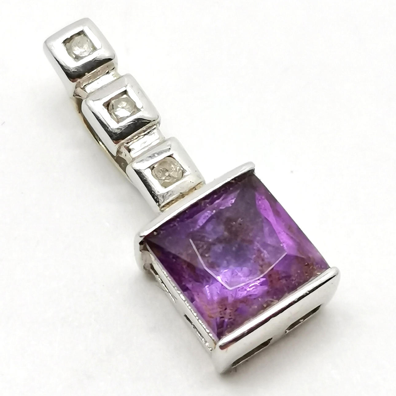 9ct WHITE GOLD AMETHYST & DIAMOND SET PENDANT.