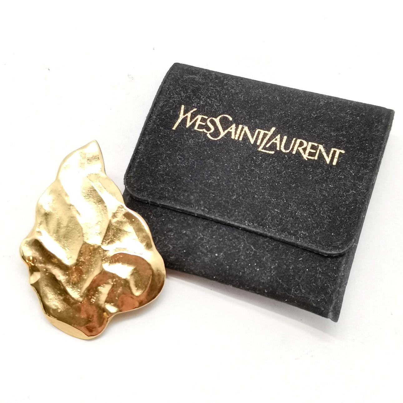 *YVES SAINT LAURENT FLAME PIN BROOCH.