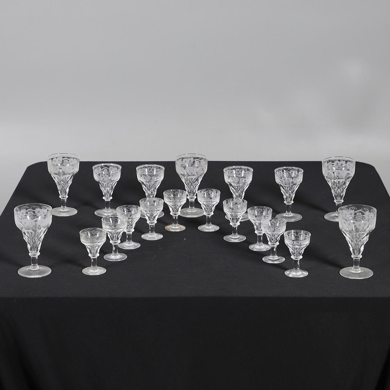 ASSORTED ETCHED DRINKING GLASSES.