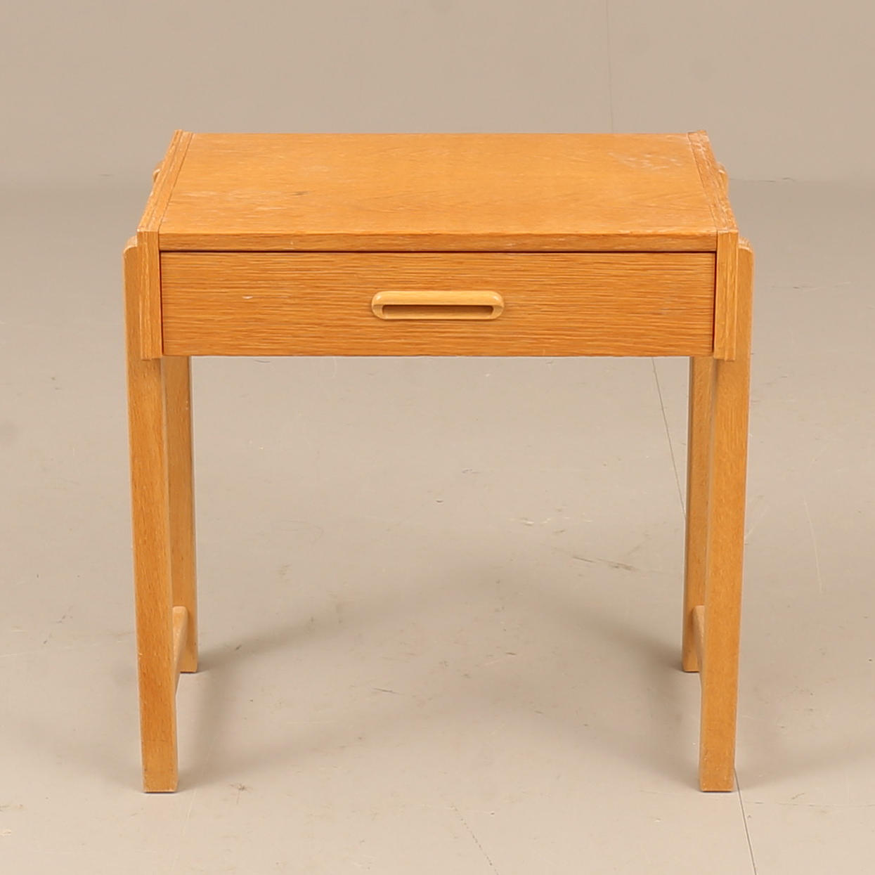 A 1960s-century oak bedside table.