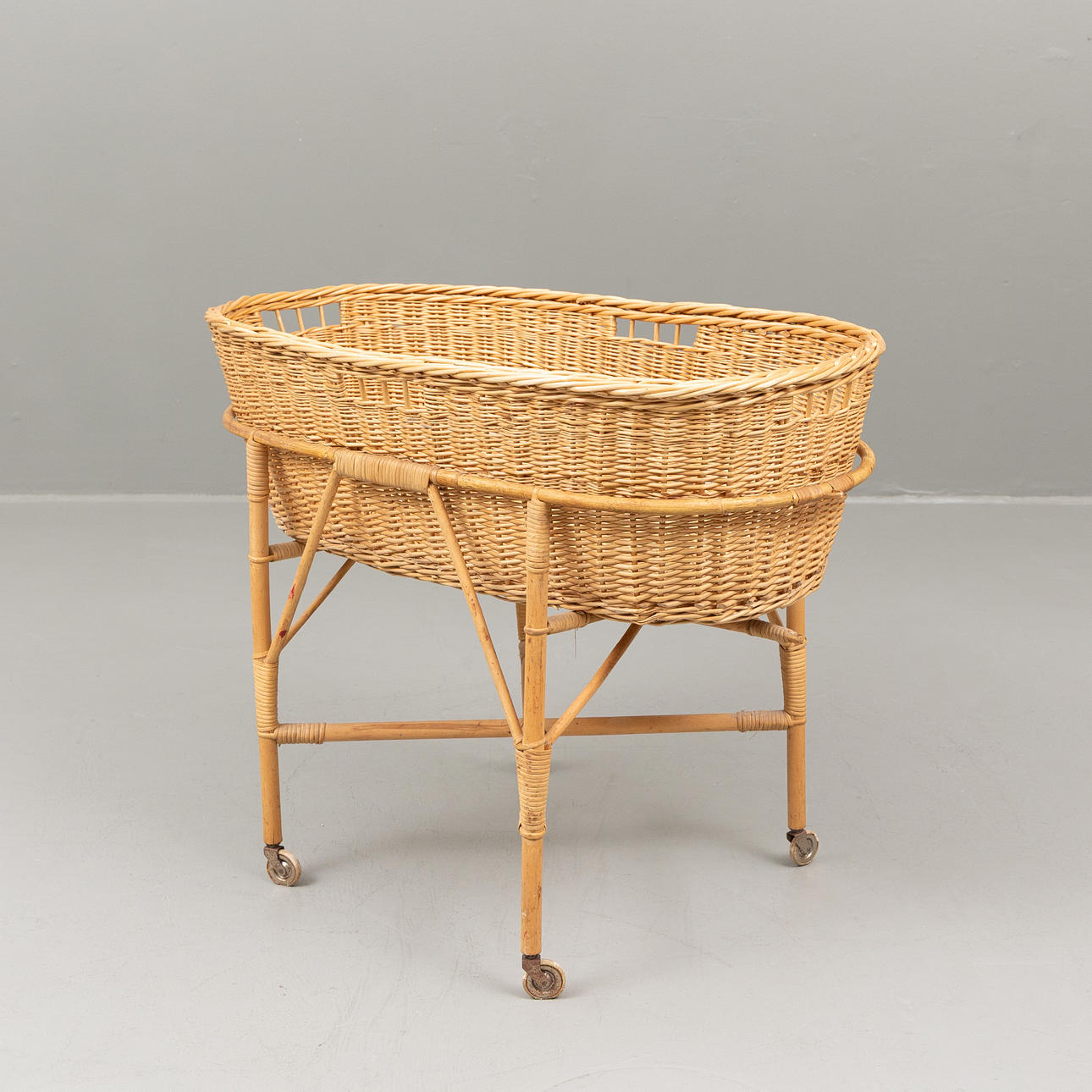 A wicker basket with base, mid 20th century.