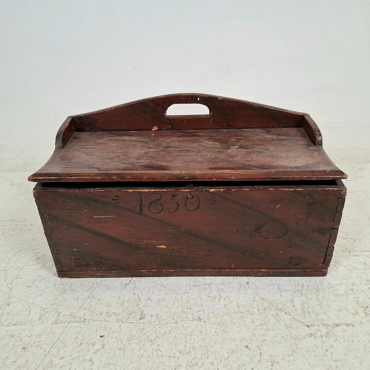 A chest of drawers, dated 1850.