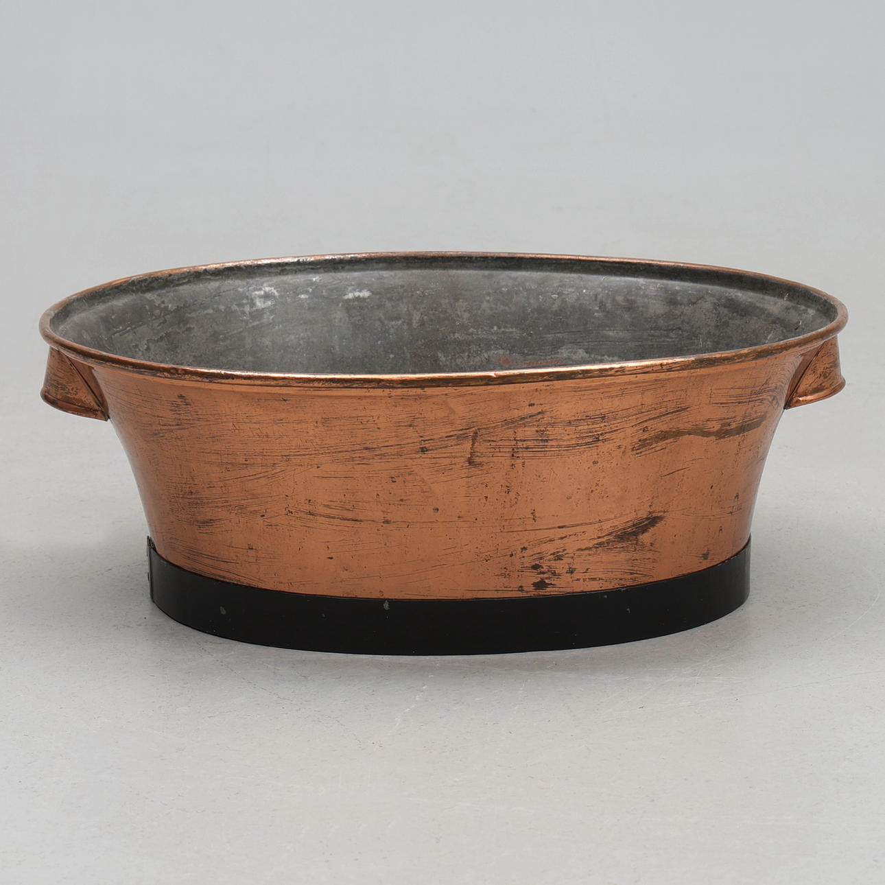 A 20th-century copper wash basin.
