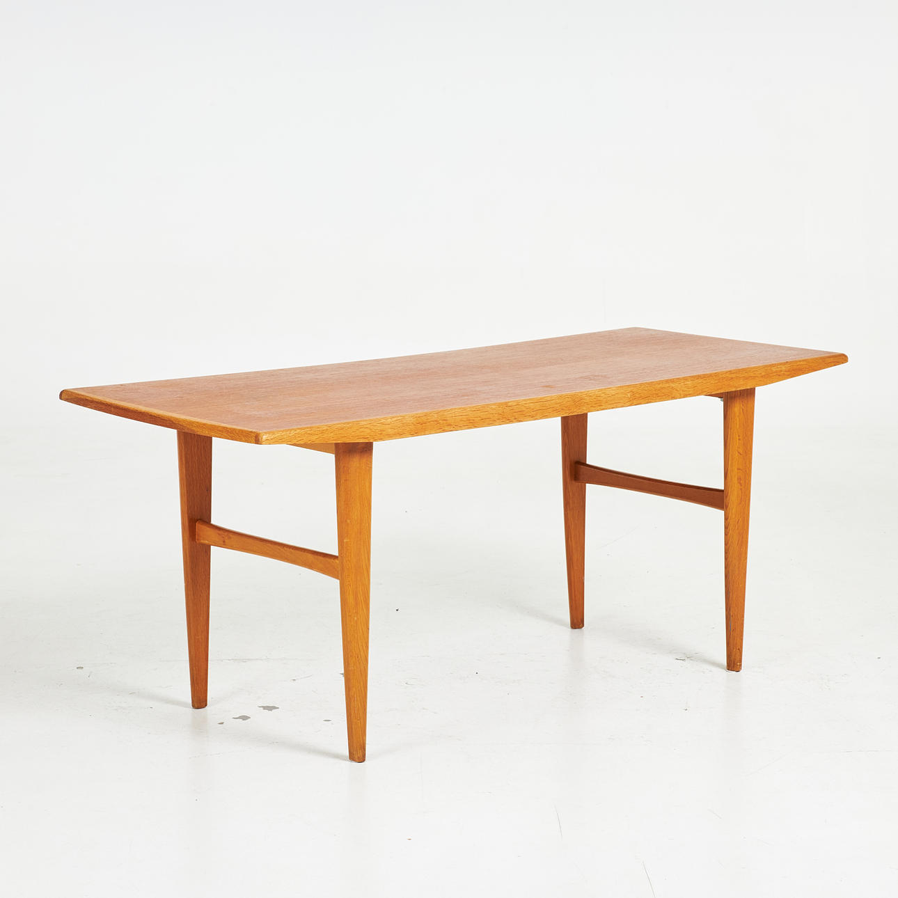 COFFEE TABLE. A mid 20th century teak veneer.