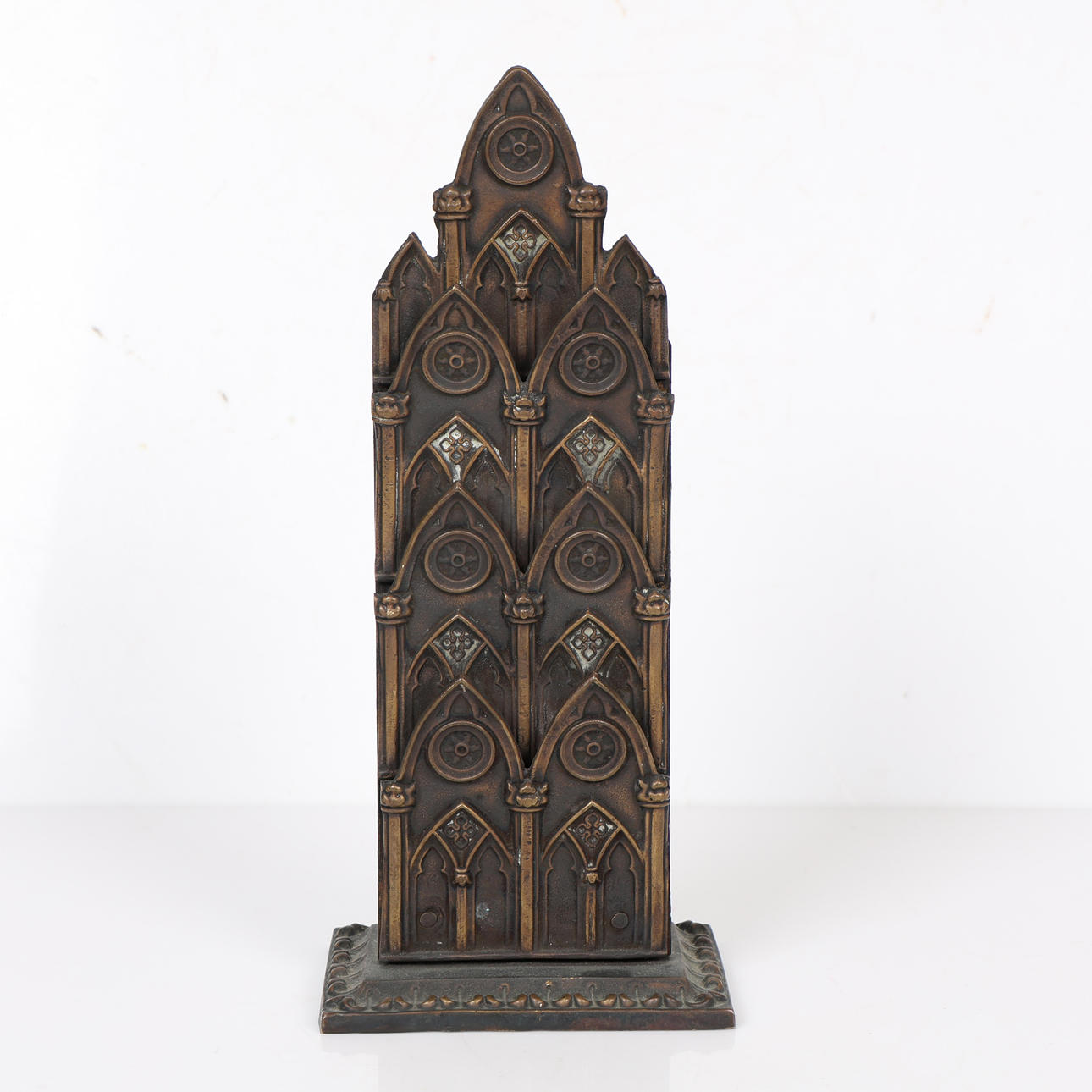 A 19TH CENTURY BRONZE GOTHIC LETTER RACK.