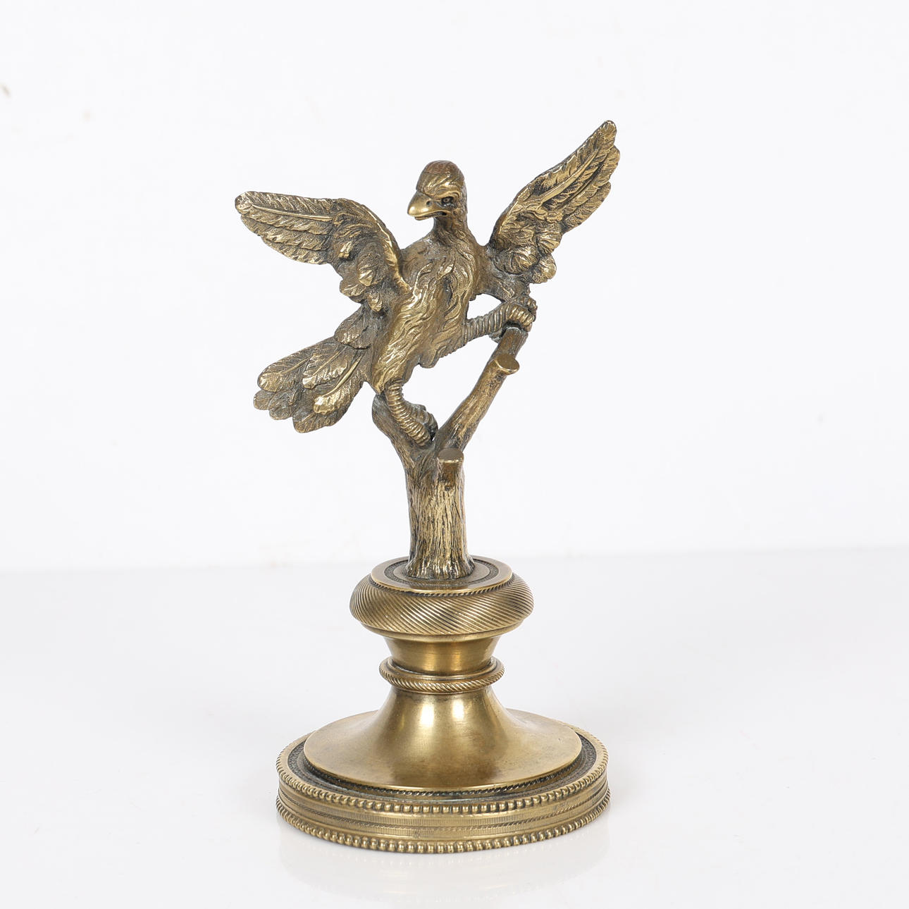 A REGENCY GILT BRONZED EAGLE DESK WEIGHT.