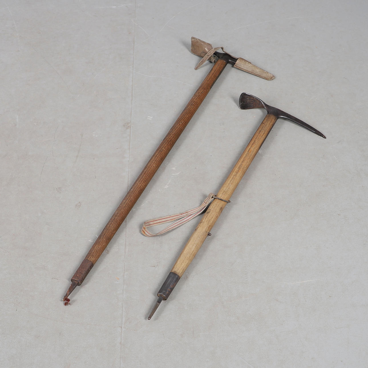 TWO CLIMBING ICE AXES.