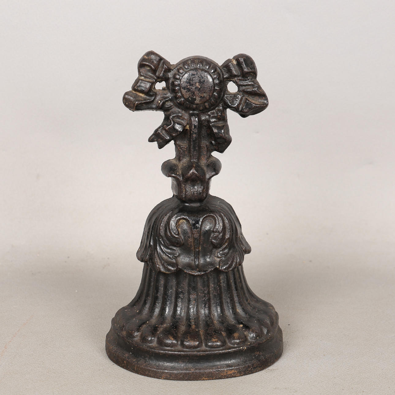 A VICTORIAN CAST IRON DOOR STOP.