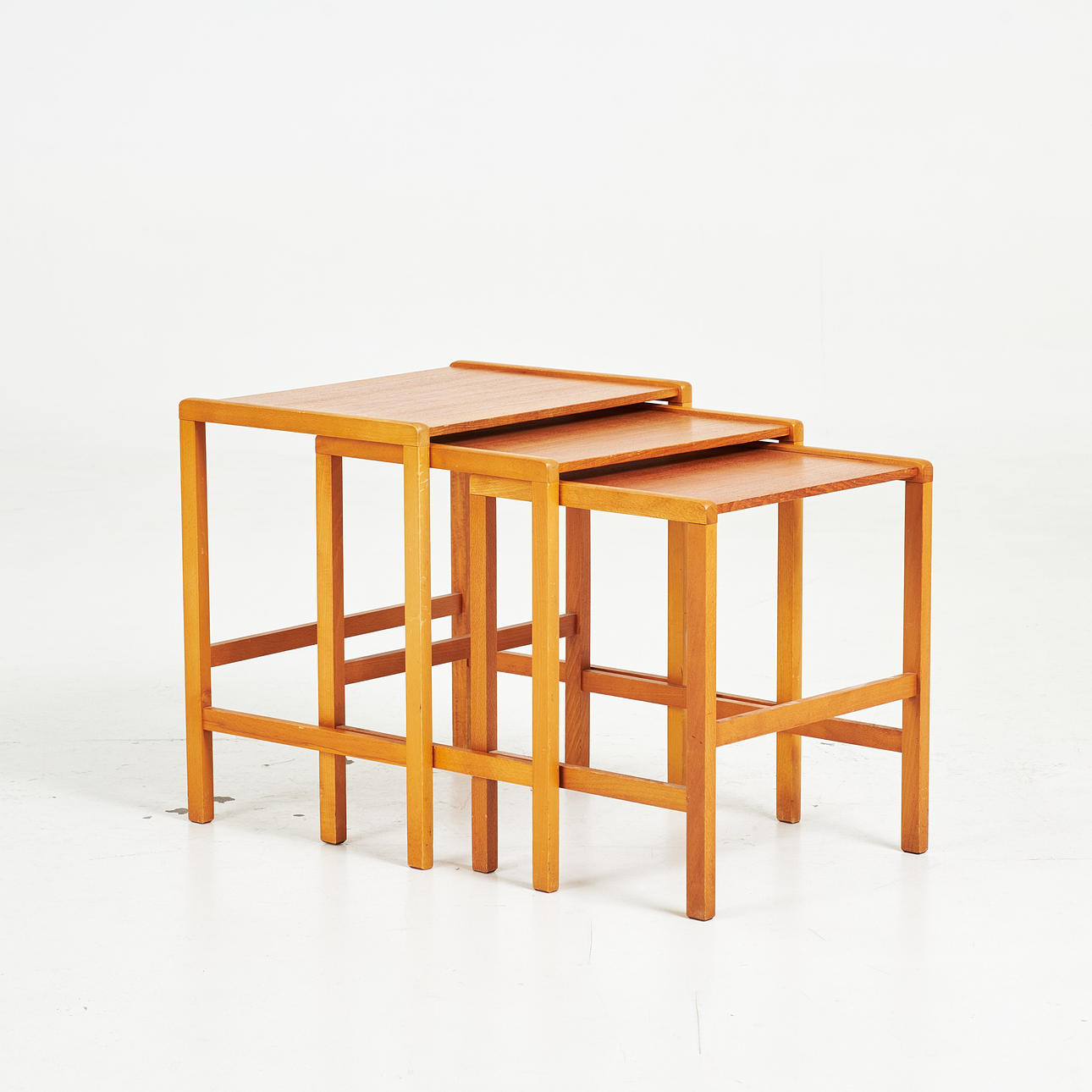 A set table, 1960s, beech frame and sheets veneered with teak.