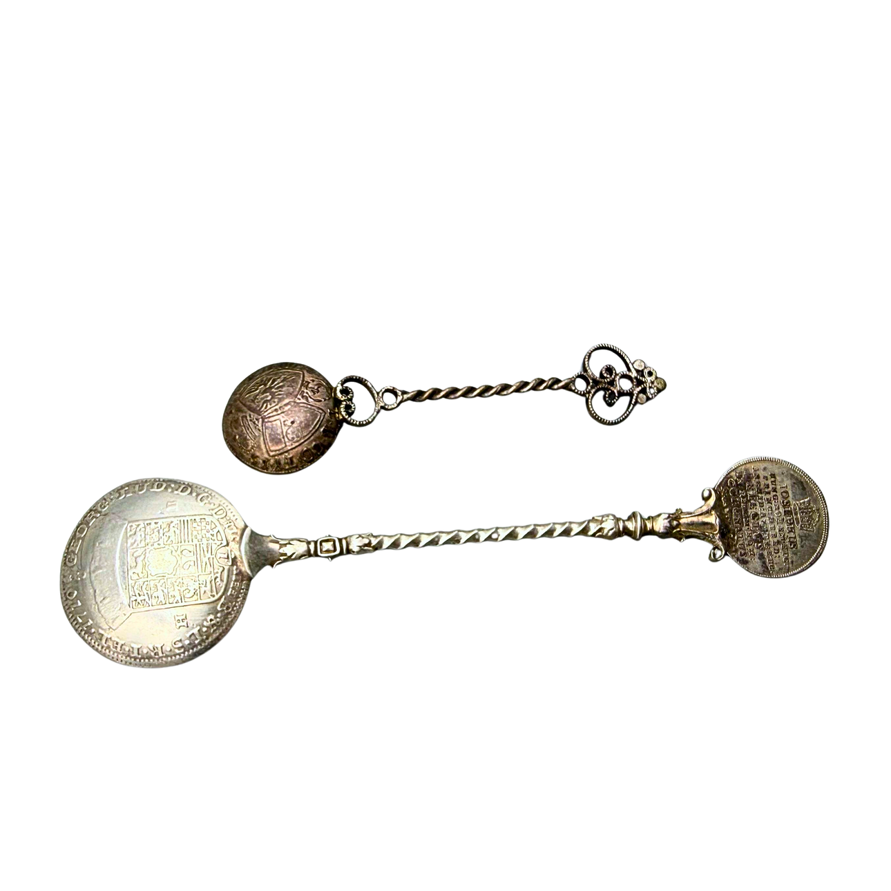 TWO DIFFERENT COLLECTOR COIN SPOONS.