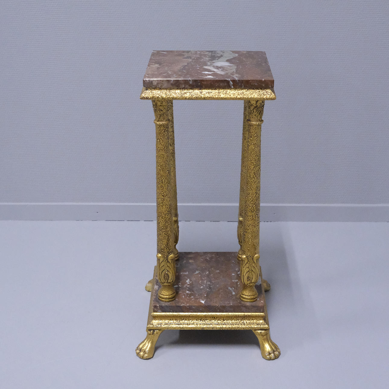 PEDESTAL WITH MARBLE COUNTERTOPS.