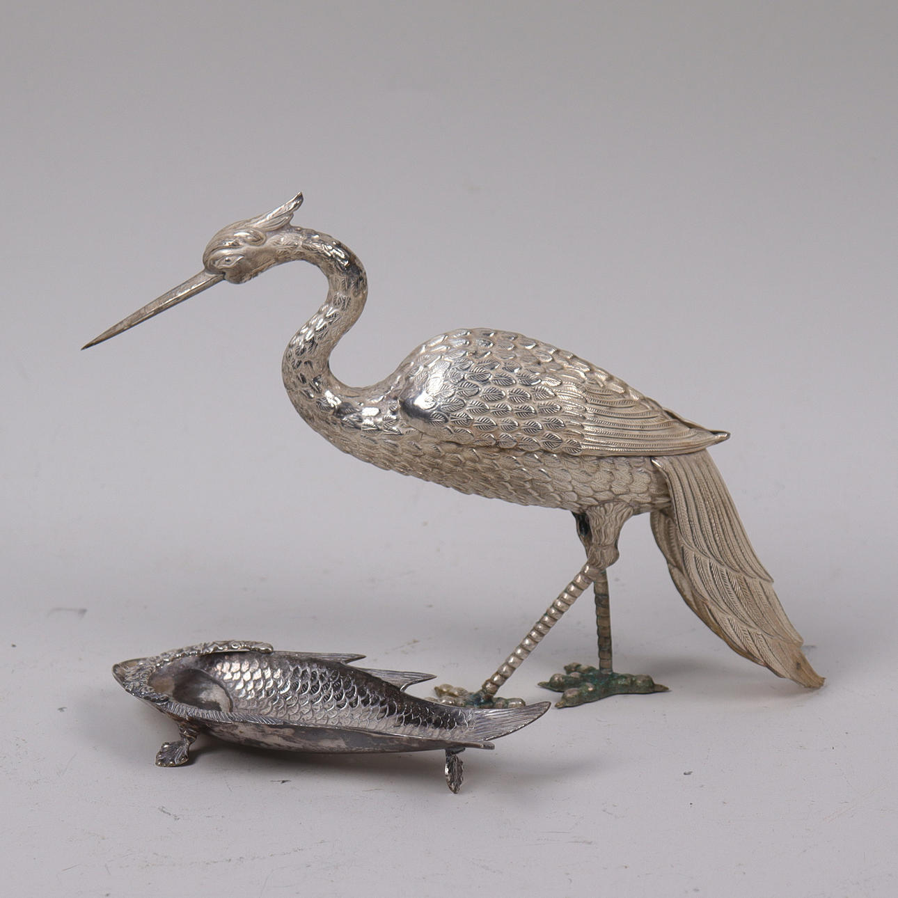 TABLE DECORATIONS, heron and fish in nickel silver.