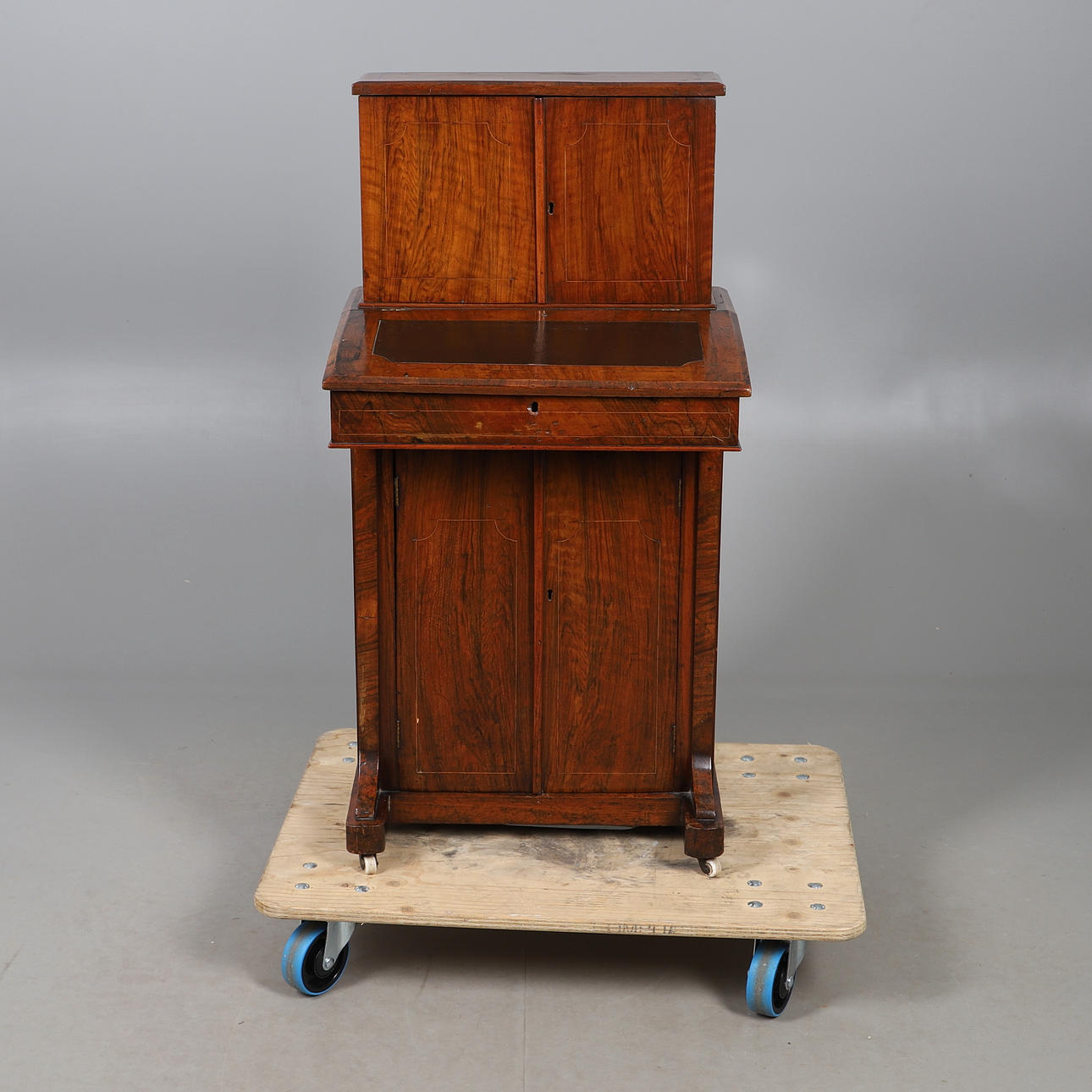 A 19TH CENTURY WALNUT DAVENPORT.
