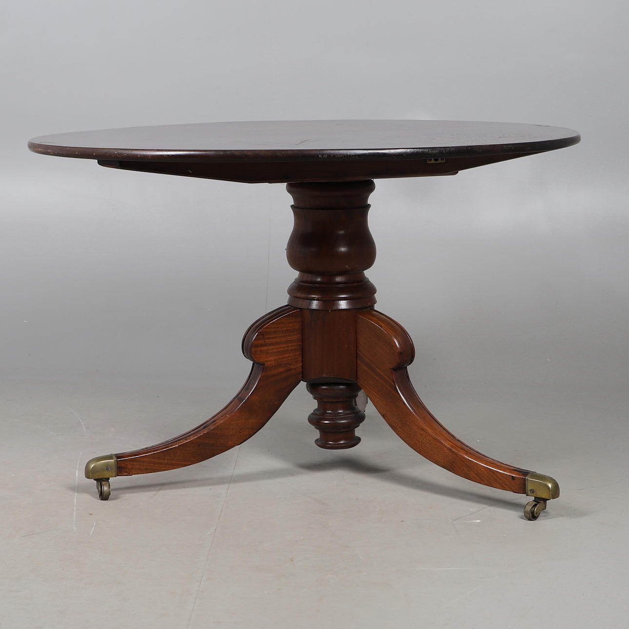 MAHOGANY TILT-TOP OVAL TRIPOD TABLE.