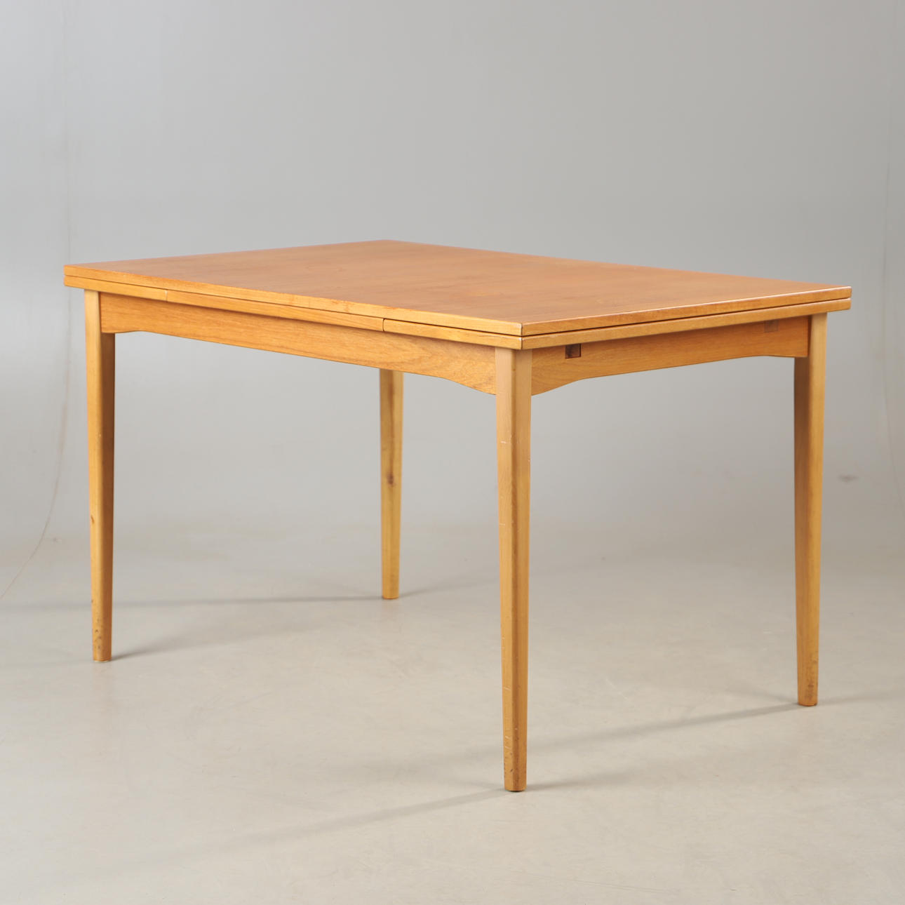 DINING TABLE, teak and beech, mid-20th century.