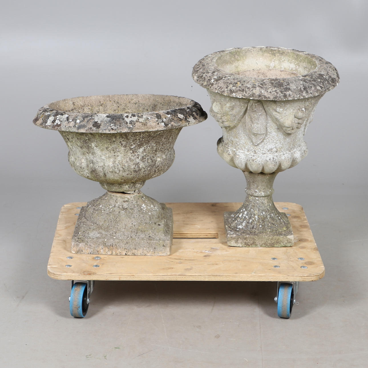TWO CONCRETE GARDEN URNS.