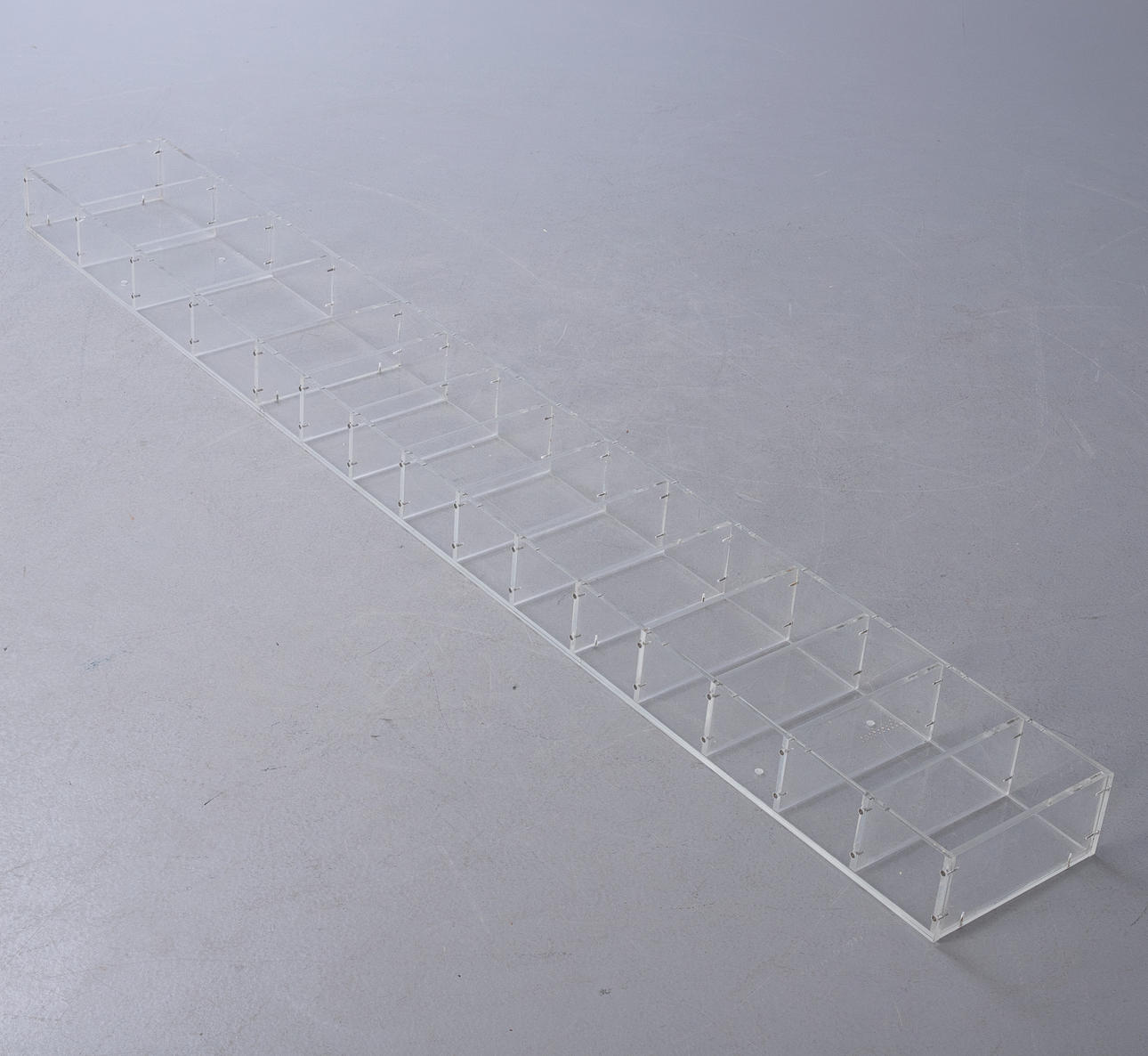 Narrow acrylic shelf / display.
