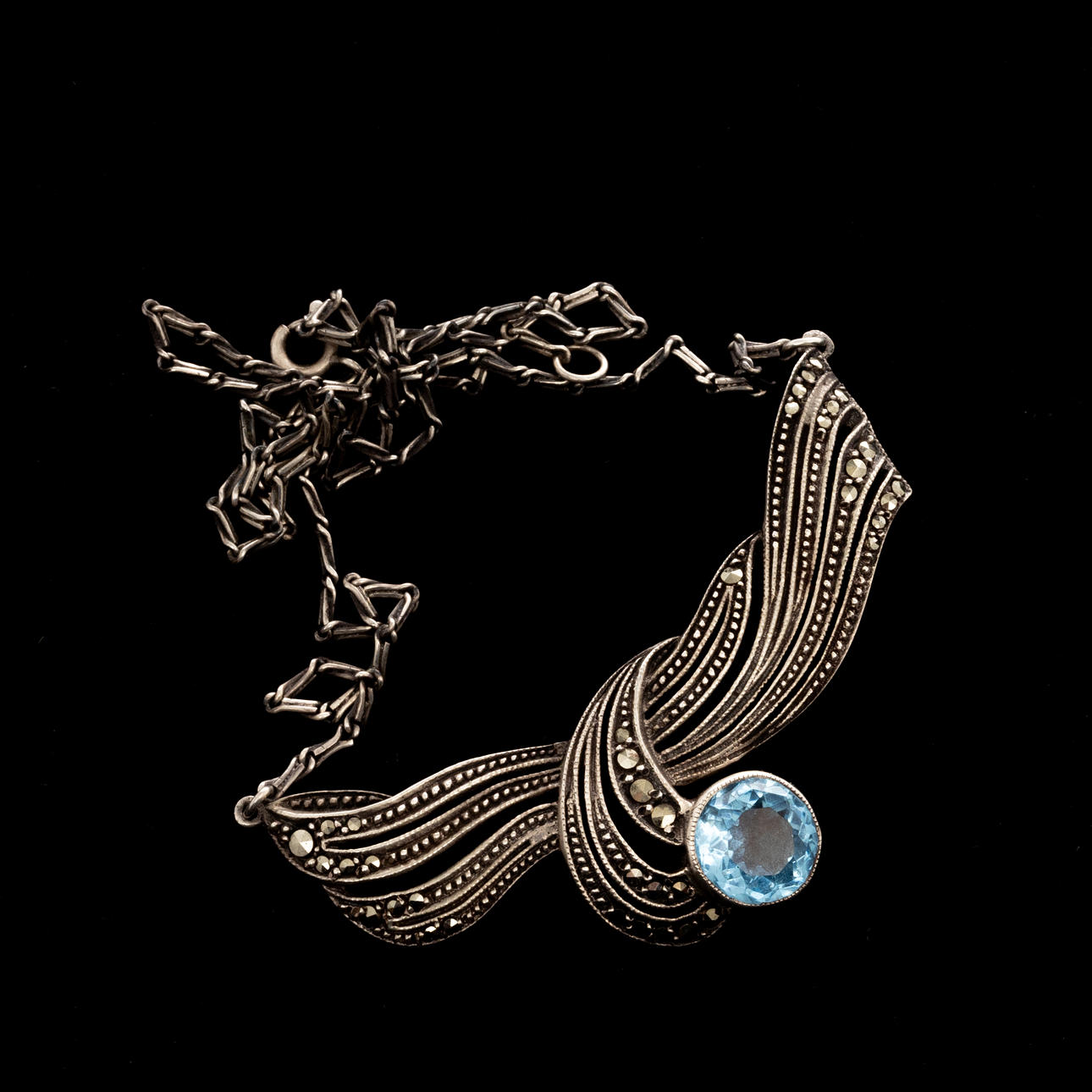 NECKLACE, Silver, marcasites, blue topaz.