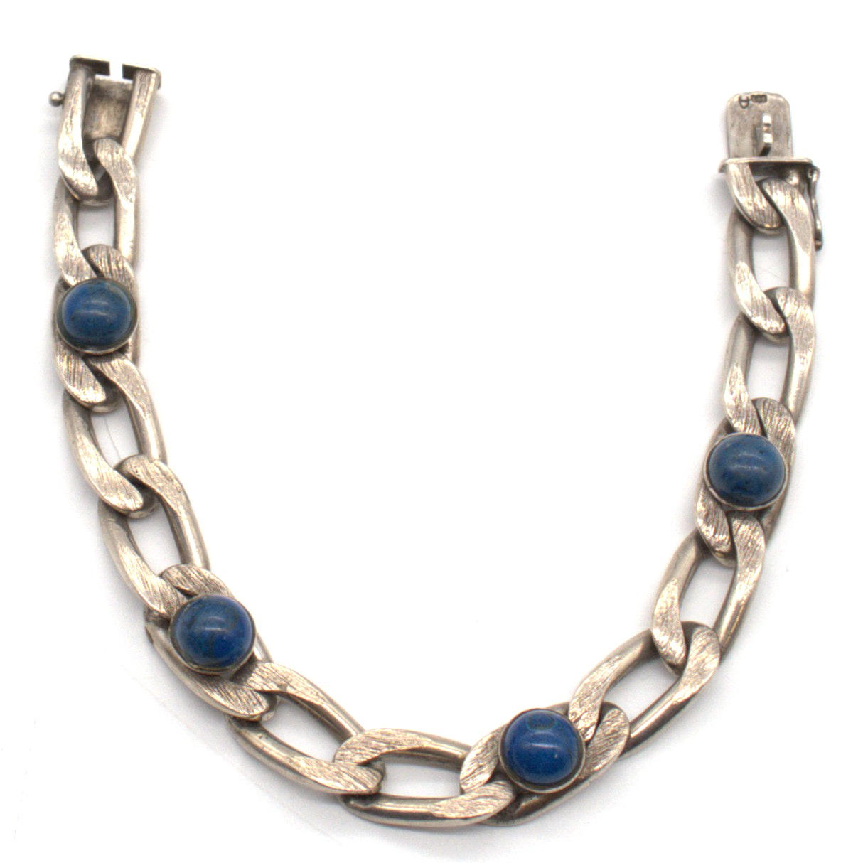 MASSIVE DESIGNER BRACELET 800 SILVER, PIERCED SETTING, SET WITH 4 LAPIS LAZULI CABOCHONS, HALLMARKED, WITH MAKER'S MARK. 20TH CENTURY.