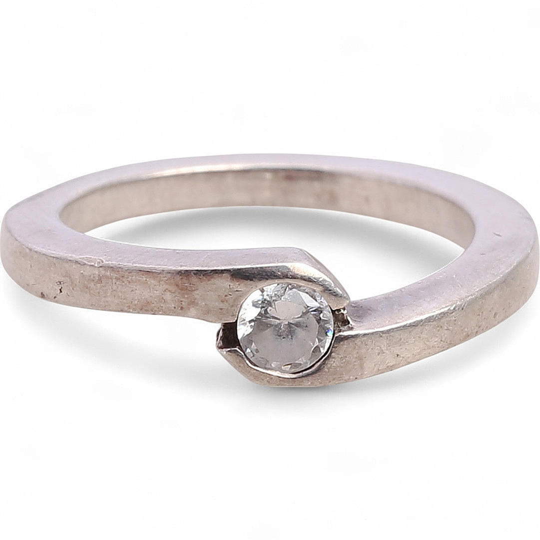 Solitaire zircon ring.