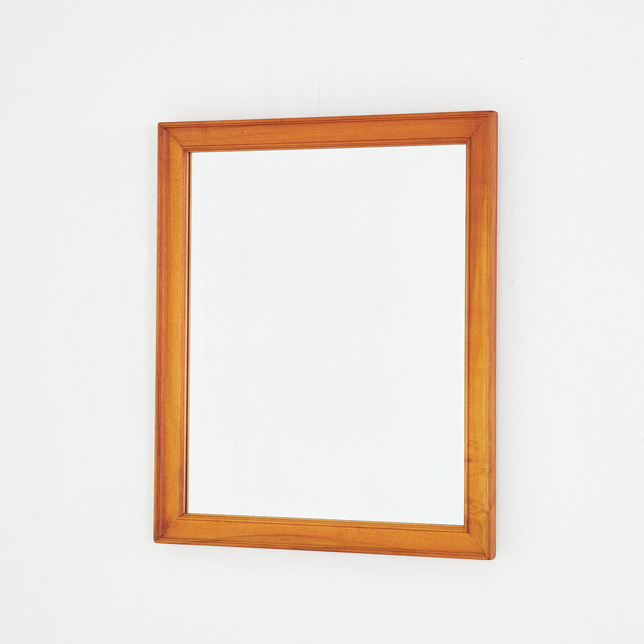 CARL MALMSTEN. Mirror, walnut, label marked.