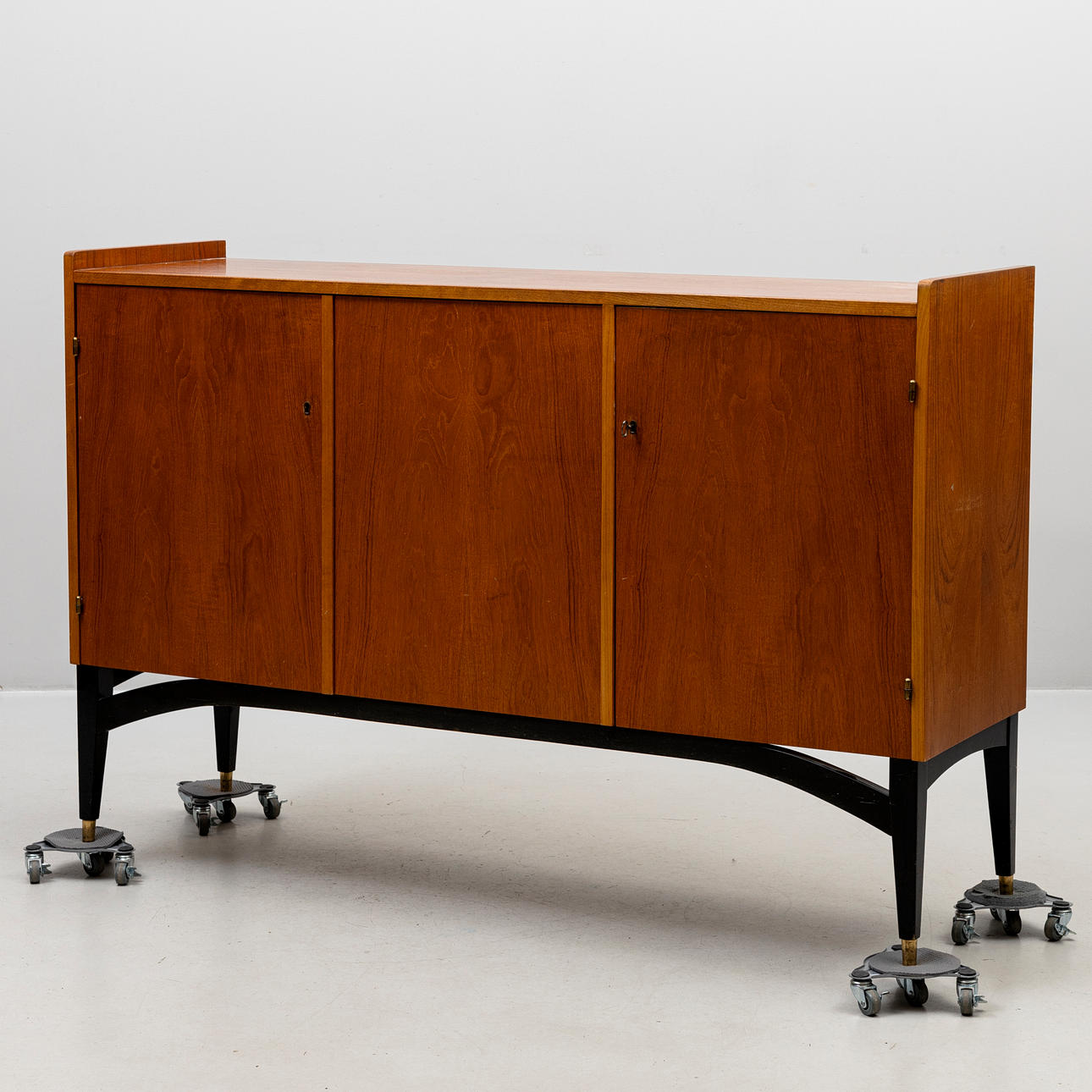 SIDEBOARD, teak veneered, partially blackened, 1960s.