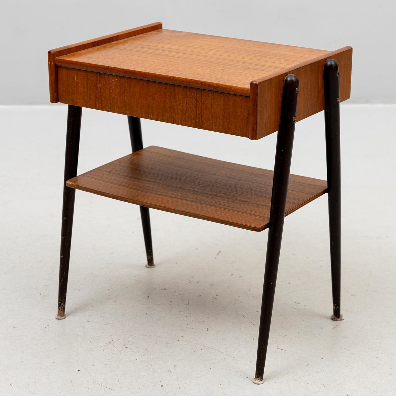 BEDSIDE TABLE, partially veneered in teak, 1960s.