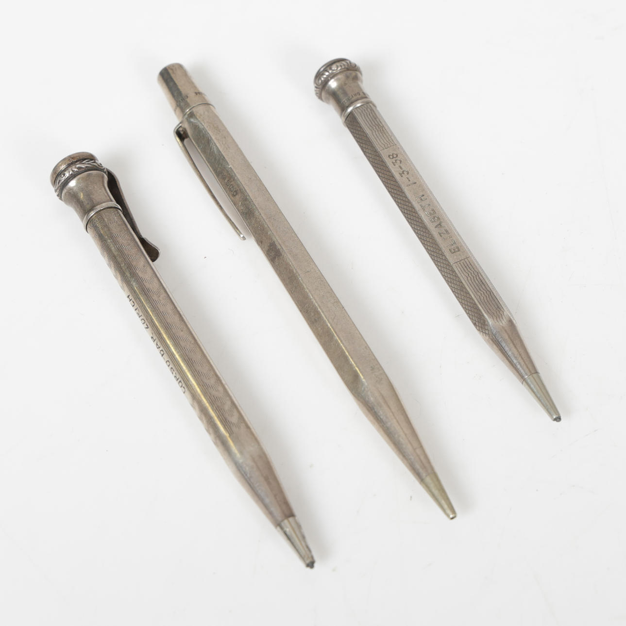 THREE SILVER PROPELLING PENCILS (3).