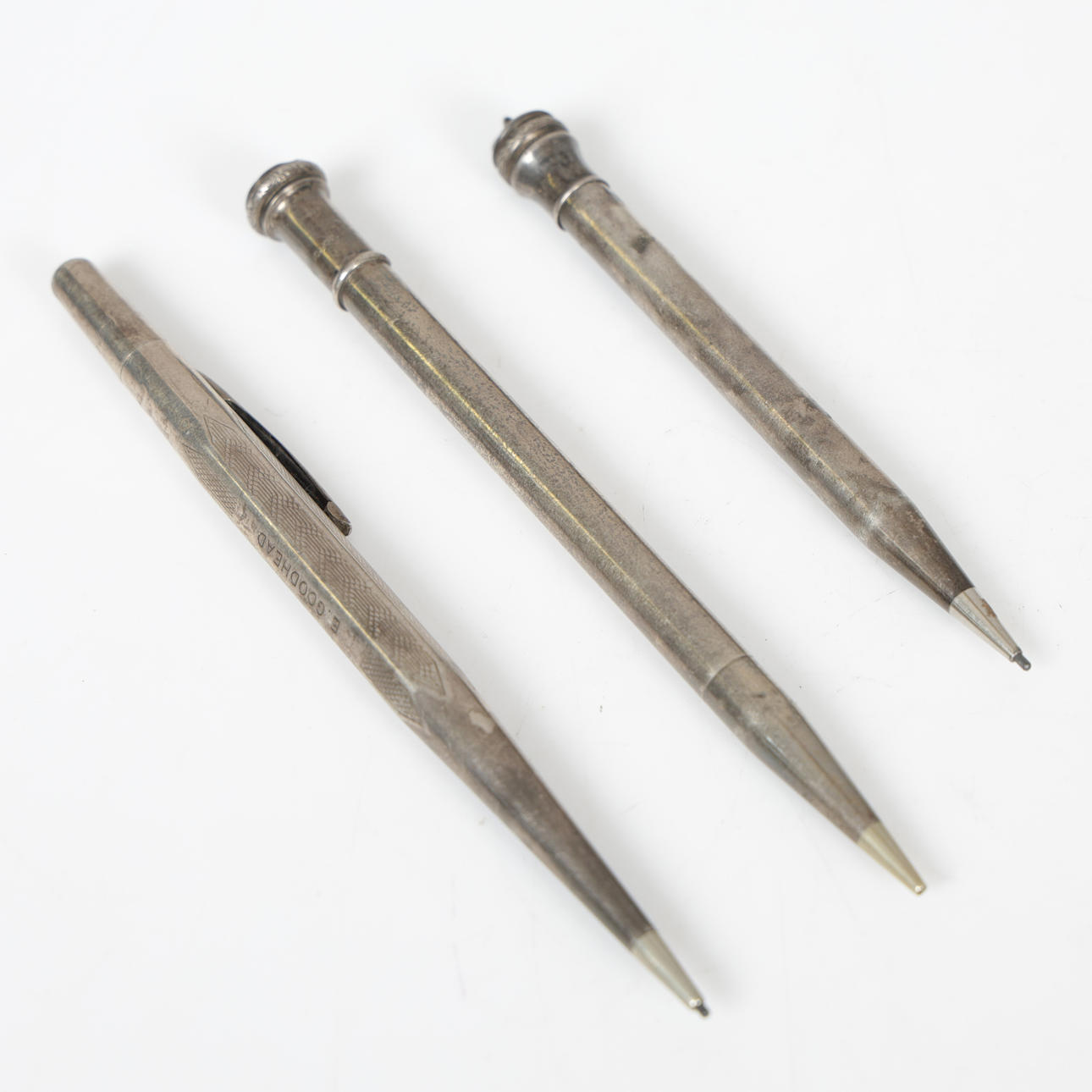 THREE SILVER PROPELLING PENCILS (3).