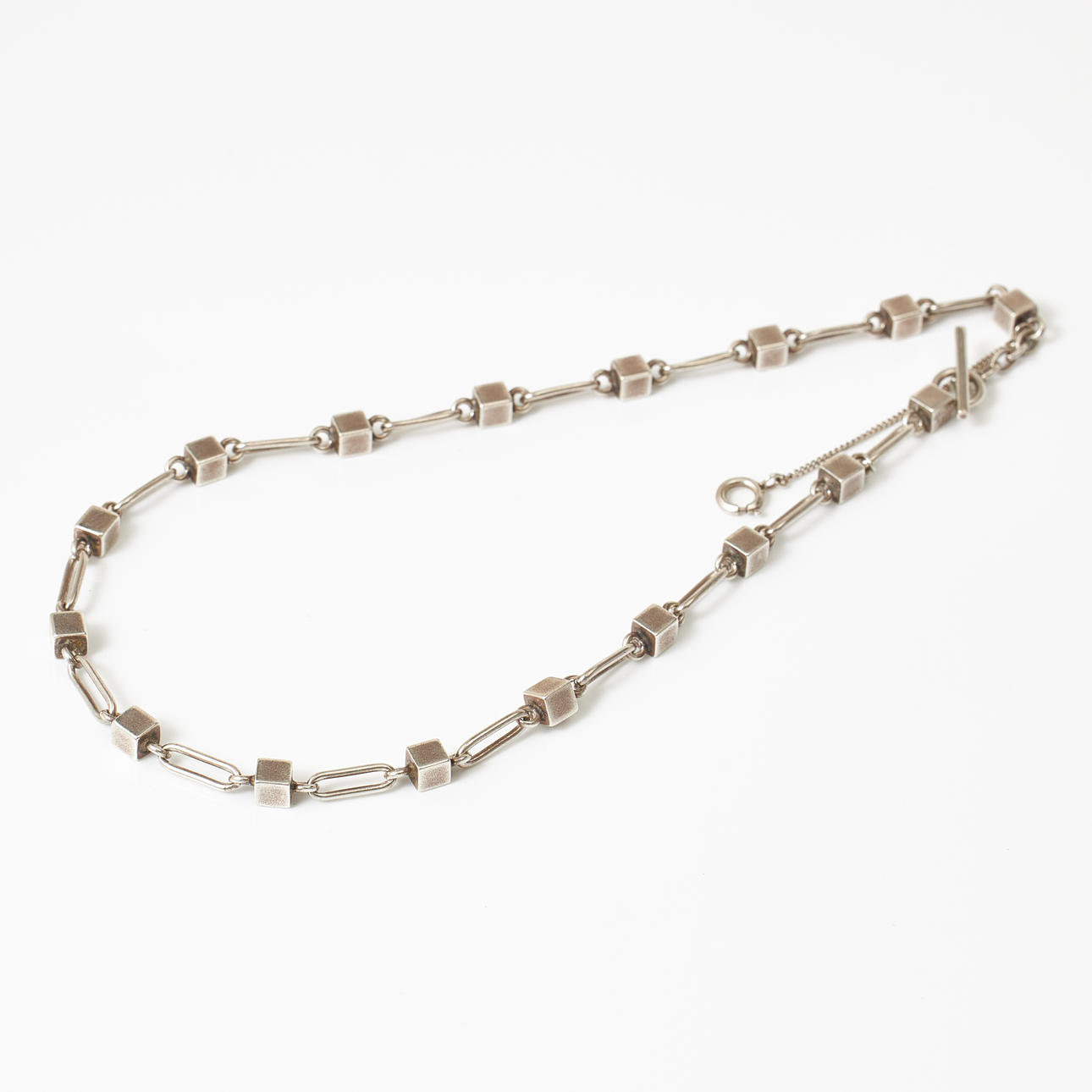 NECKLACE, sterling silver, cube formations with intermediate elliptical decorative elements, Jens Andersen, 1960s, Denmark, toggle clasp.
