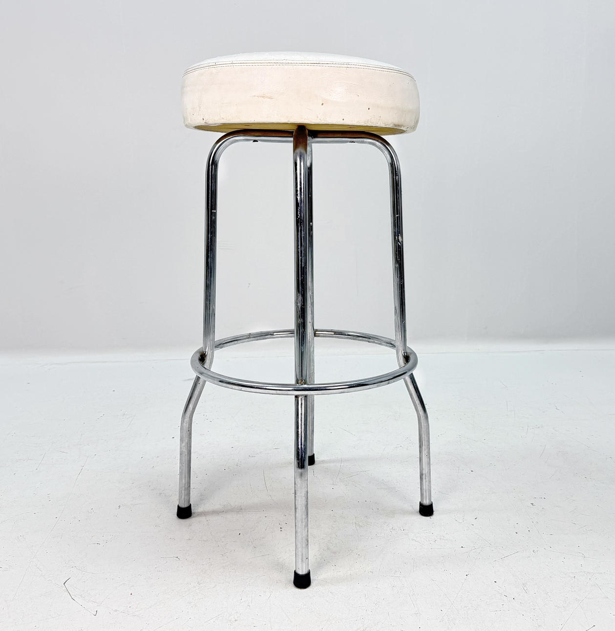 BAR STOOL with footrest, chrome, leather, marked Johanson Design.