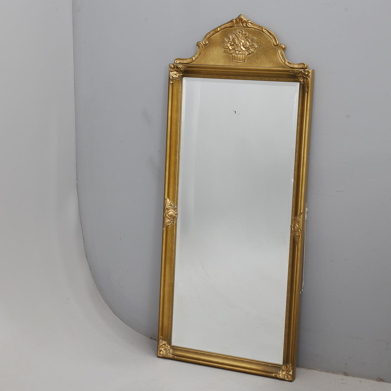 MIRROR, gold-coloured.