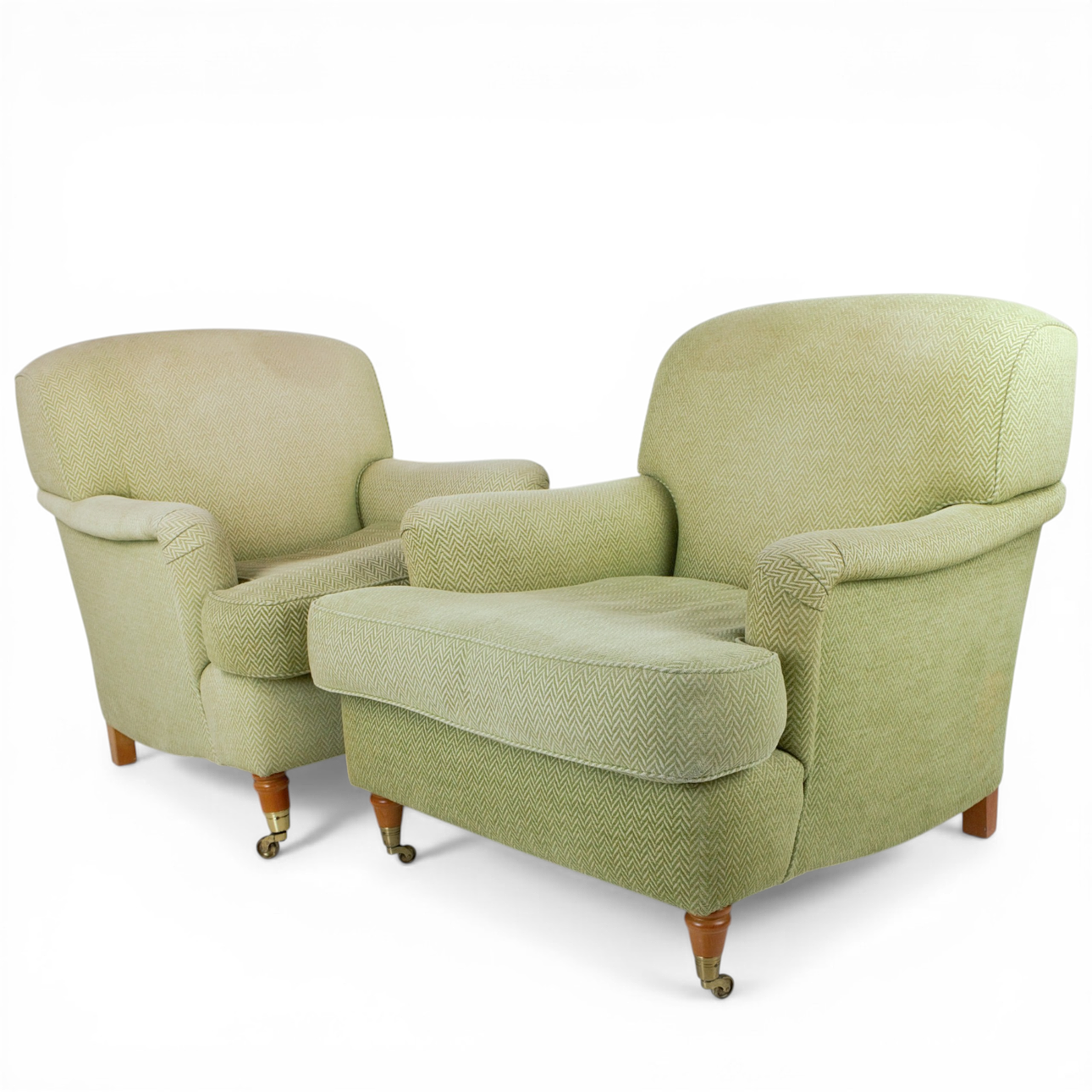 ARMCHAIRS, a pair, Howard model, casters at the front, probably Engelson.